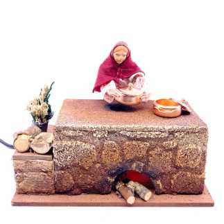 Donna che cucina in movimento.
Indicato per statuine 12-13 cm.