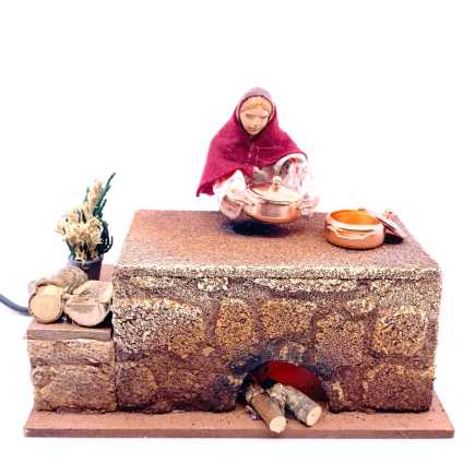 Donna che cucina in movimento.
Indicato per statuine 12-13 cm.
